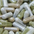 Who should you report adverse side effects of dietary supplements to?